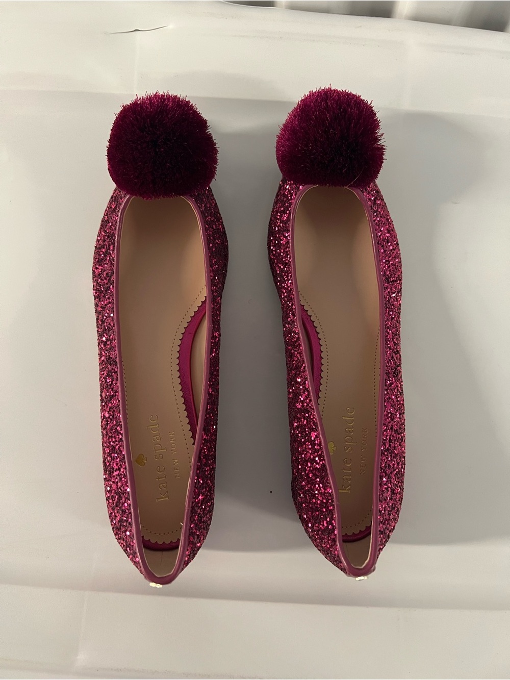 kate spade Annie fuchsia glitter pom-pom ballet flats